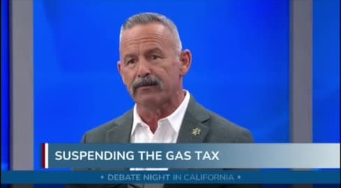 A candidate speaking at a televised debate
