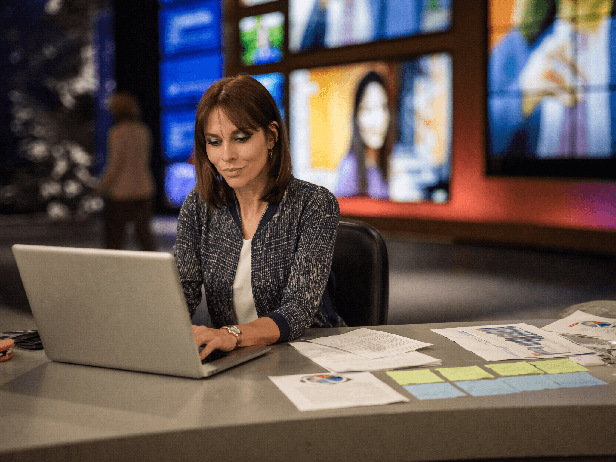 A journalist reviewing recordings